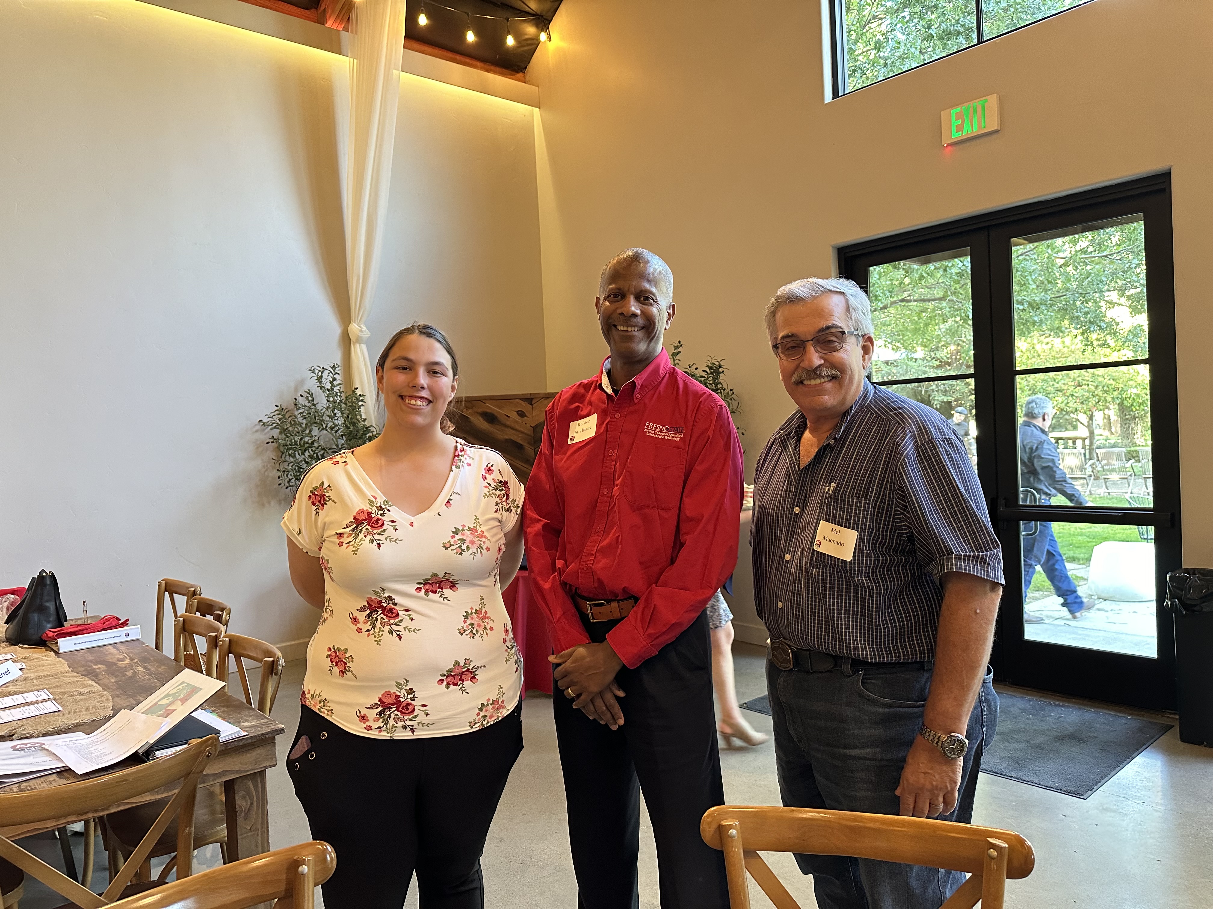 Student Karissa Allmon, Dean St. Hilaire, Committee member Mel Machado