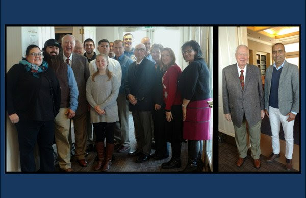 Rodger Jensen visits with scholars and professor