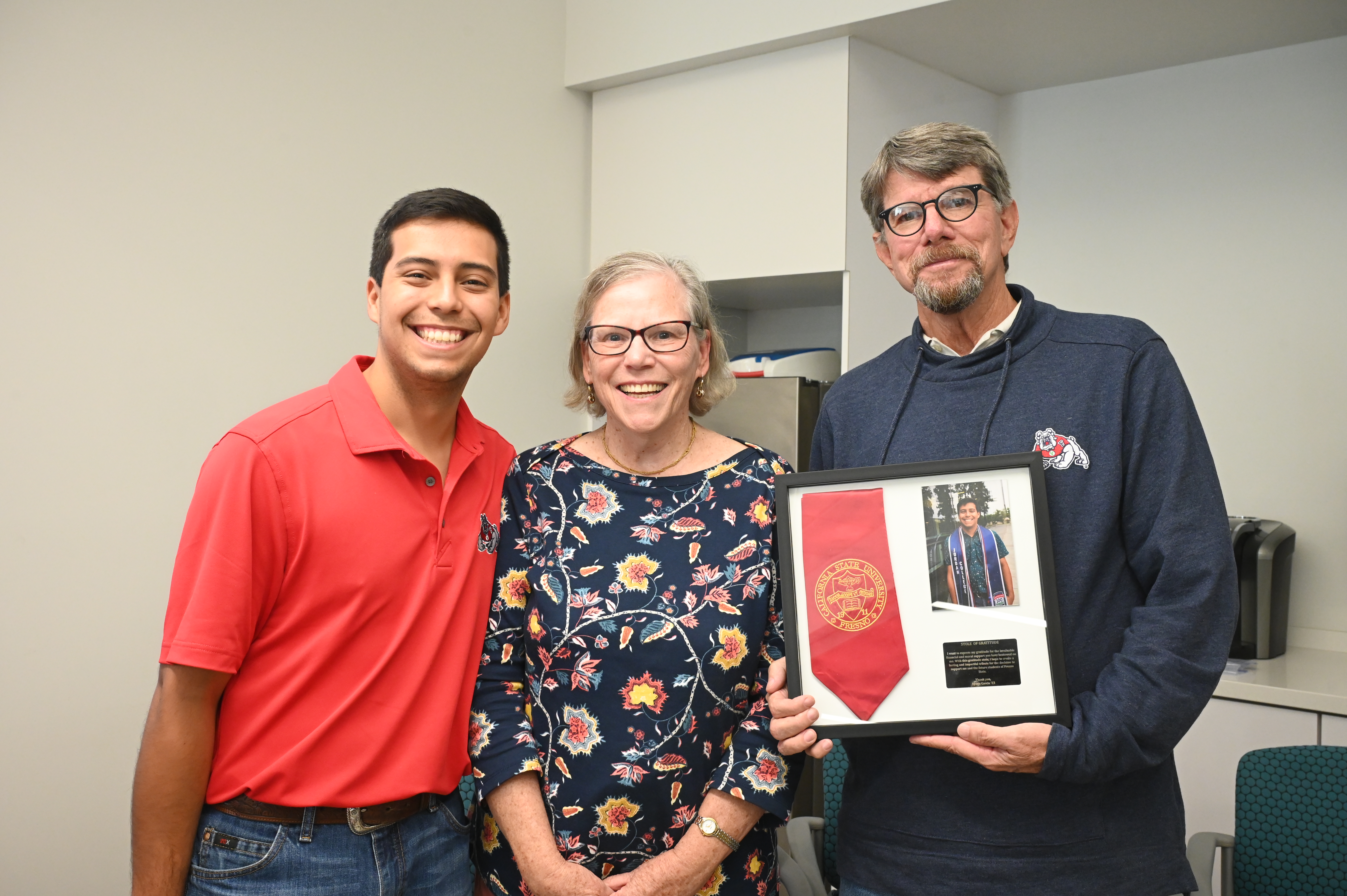 Gary and Marlene Peacock with Fresno State student Ayden Garcia 