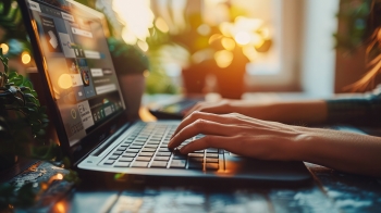 person typing on a laptop planning