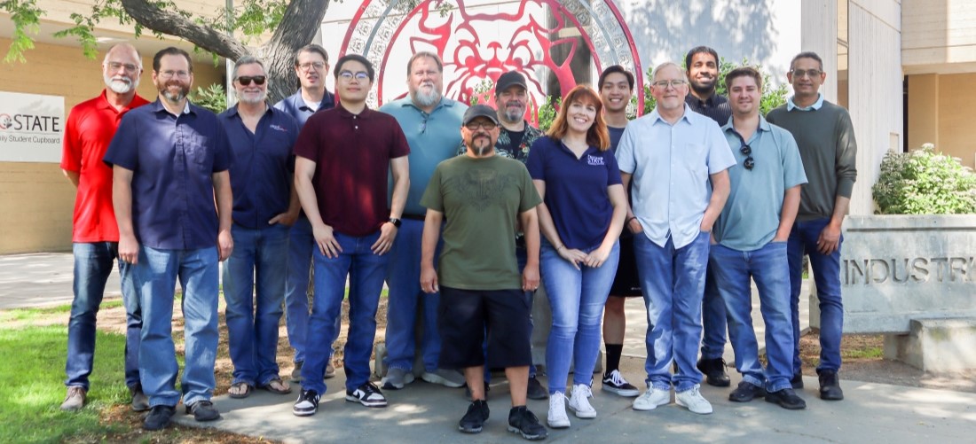 technology services group photo outside of the IT building