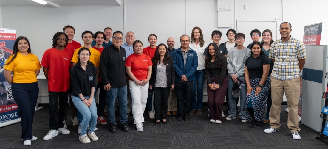 Group photo of the DXI team taken in the McKeeFisk office