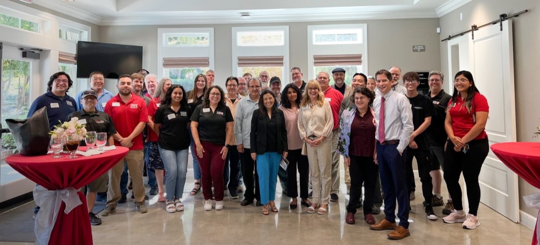 Technology services group with the president at the presidents house.