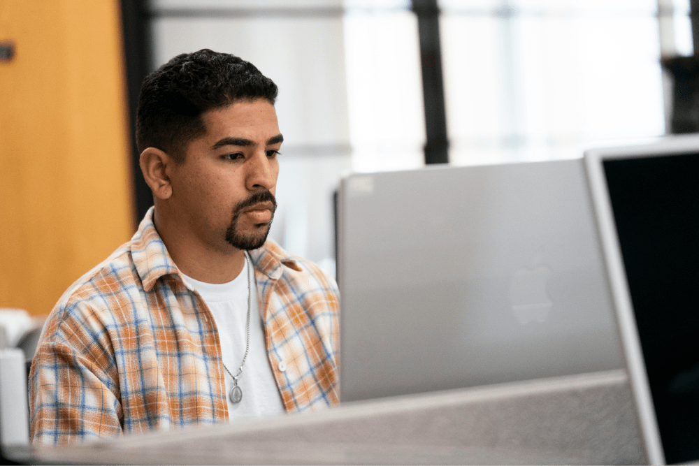 Man looking at monitor in office setting