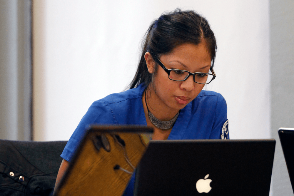 Woman looking at laptop screen