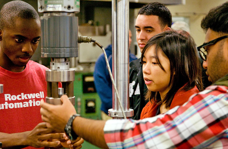 four students working in a lab
