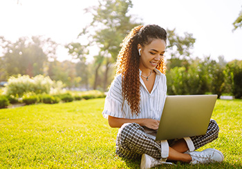 Student sitting with laptop